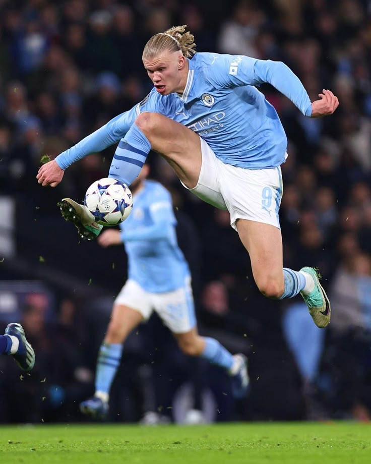 Haaland running during a football match