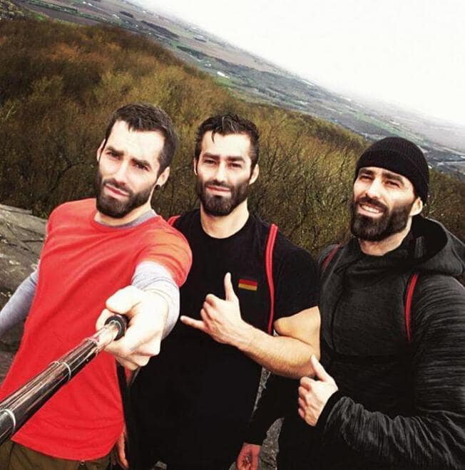 Ernest Khalimov standing with two other men outdoors