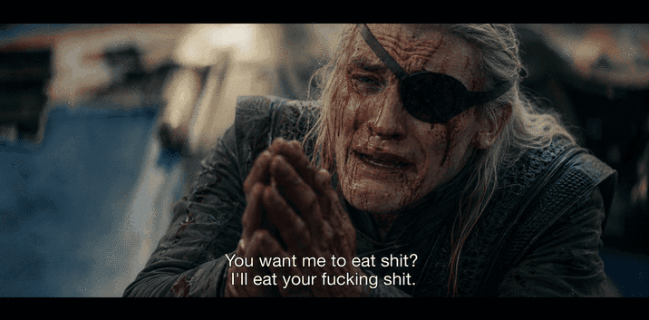 Long-haired man with an eye patch clasps his hands while subtitles show a desperate vulgar offer.