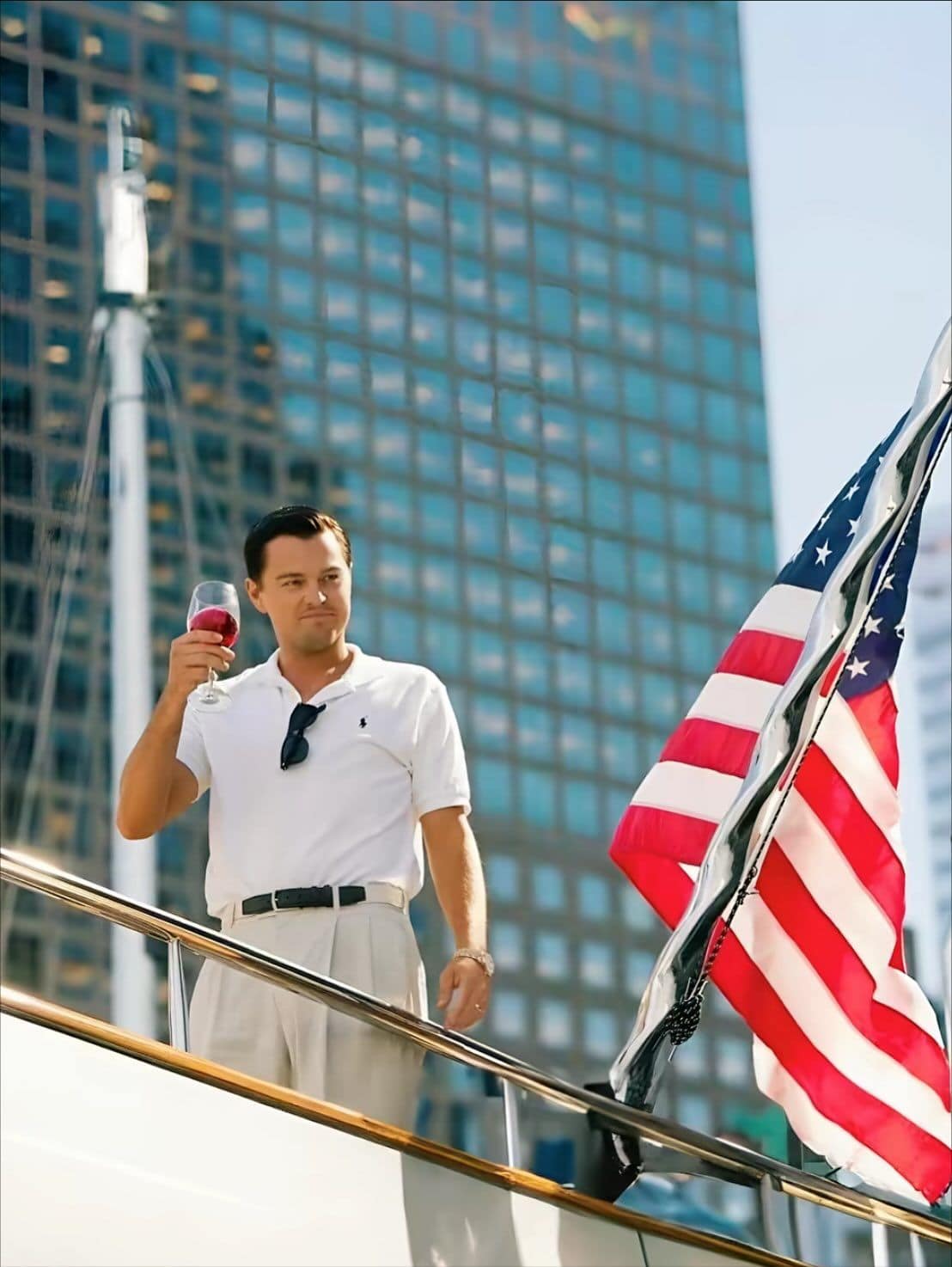 Leonardo DiCaprio raising a drink in another film scene