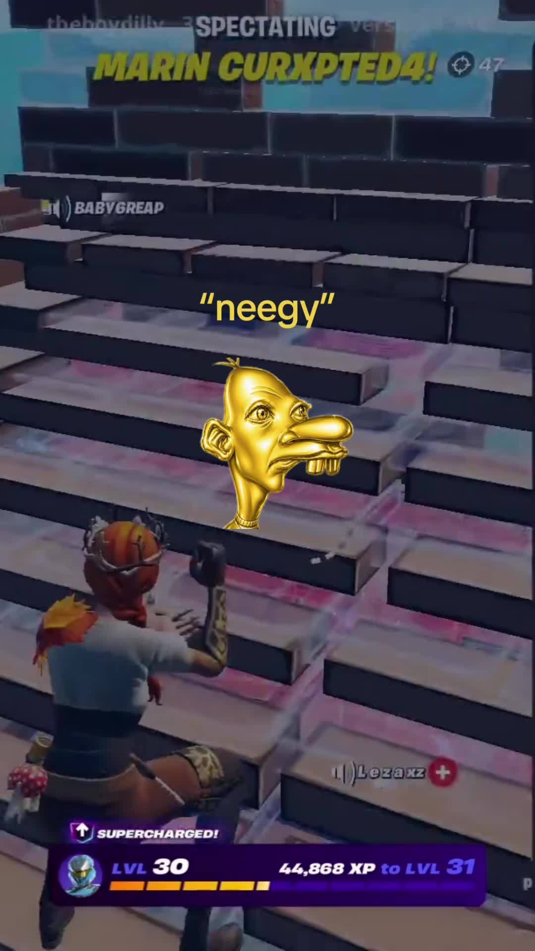 Fortnite spectator-view frame with the gold long-faced Neegy figure