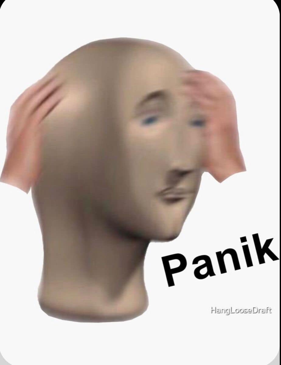 Meme Man holding his head beside the misspelled word Panik