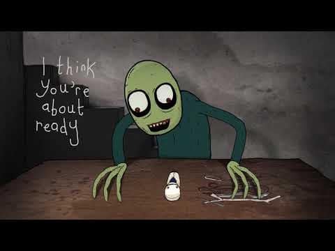 A green, wide-eyed cartoon figure with long fingers leans over a table toward a small white puppet. Handwriting on the wall reads, “I think You're about ready.”