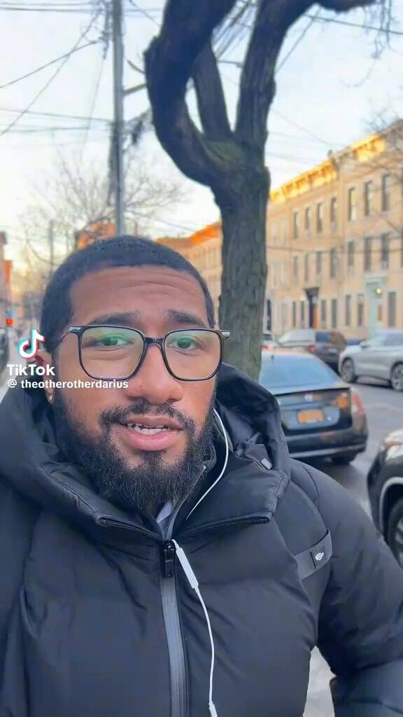 A man outdoors in a vertical social-video frame