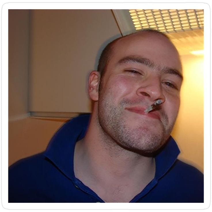 Good Guy Greg original sonriendo con un porro