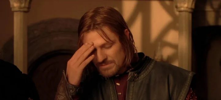 Boromir covers his face in a scene from The Fellowship of the Ring.