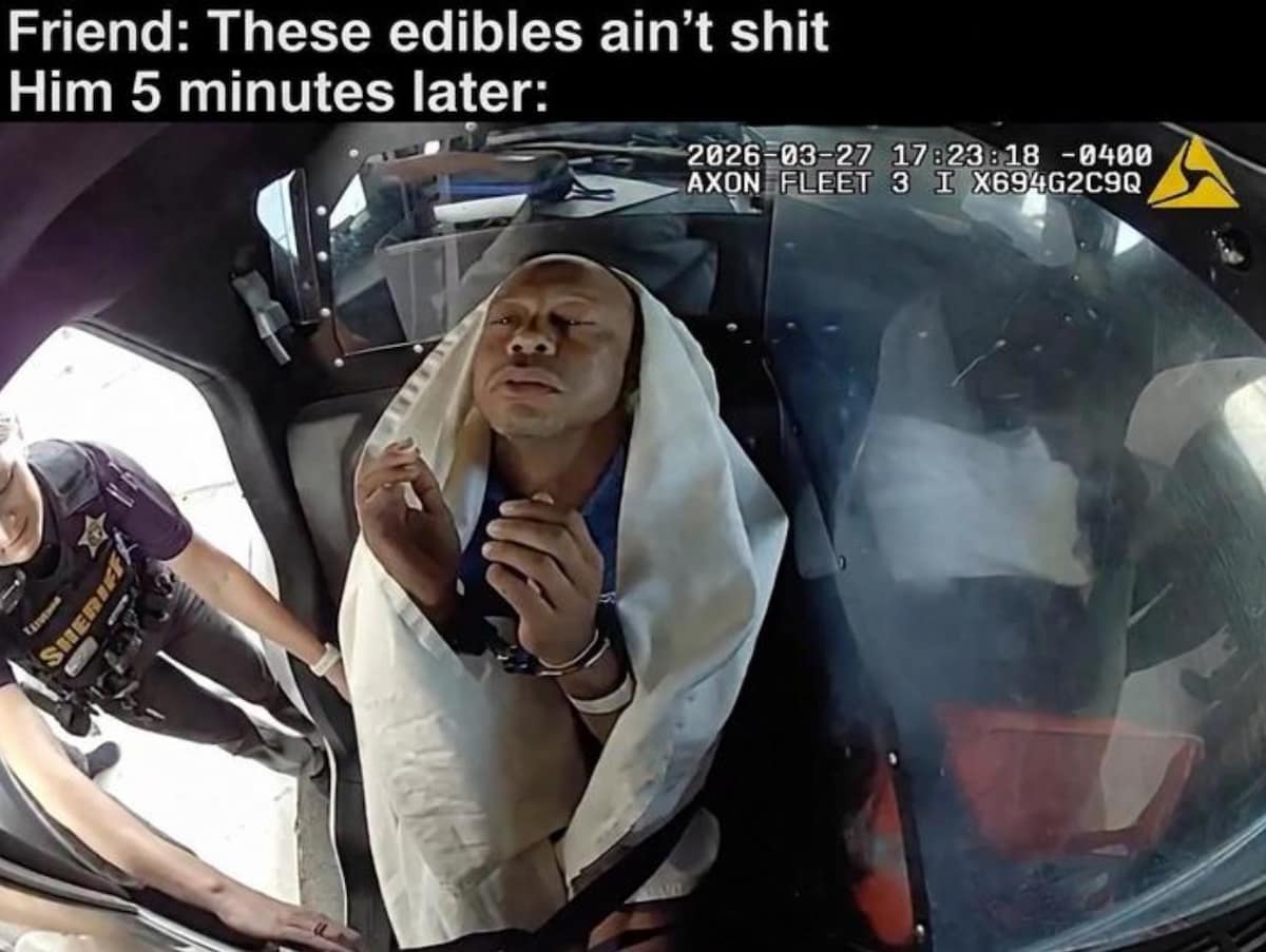 Viral meme post built from Tiger Woods' towel-over-the-head patrol car frame